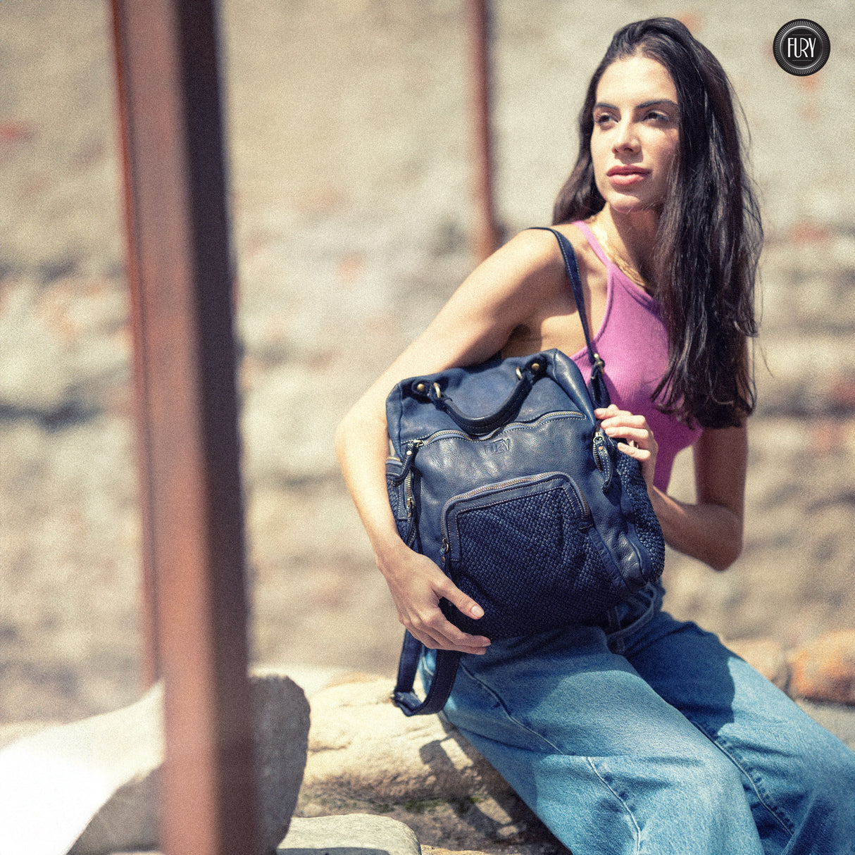 Multi-pocket backpack in woven leather